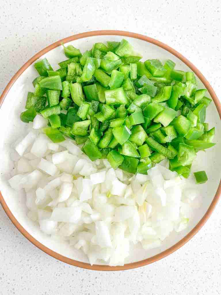 bell pepper and onion diced on a plate