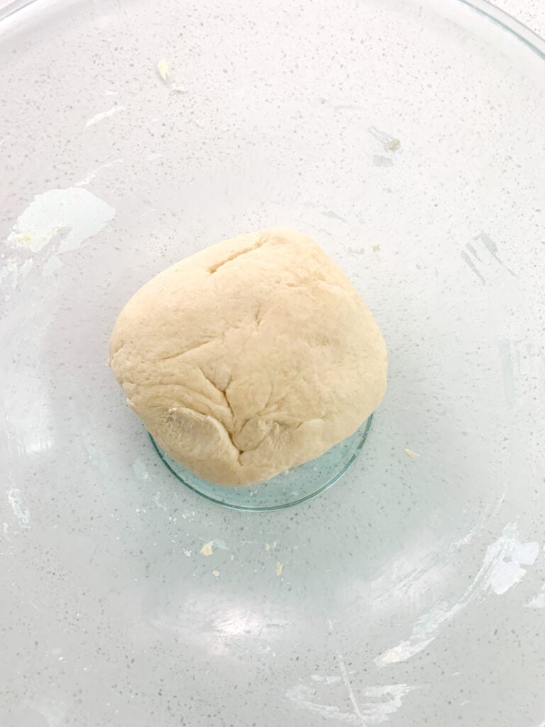 crescent roll dough kneaded and ready for fermenting