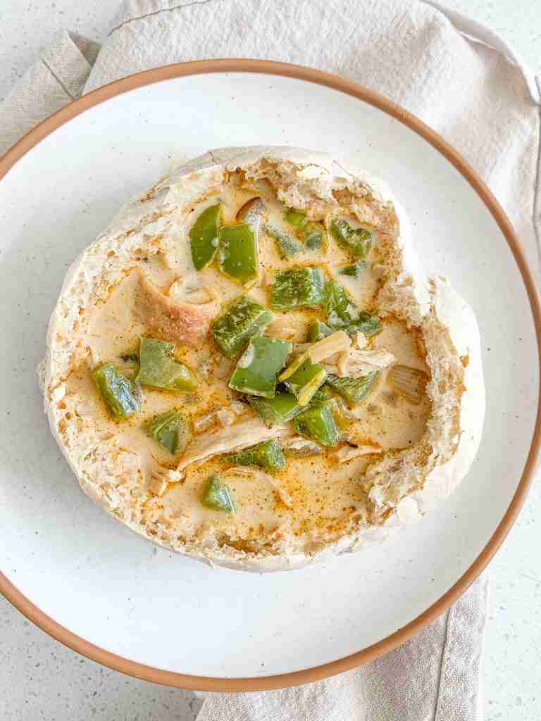 freshly made creamy cajun chicken soup in a bread bowl