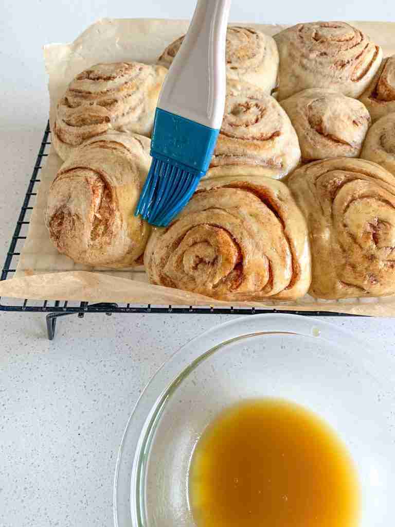 brushing glaze on honey buns