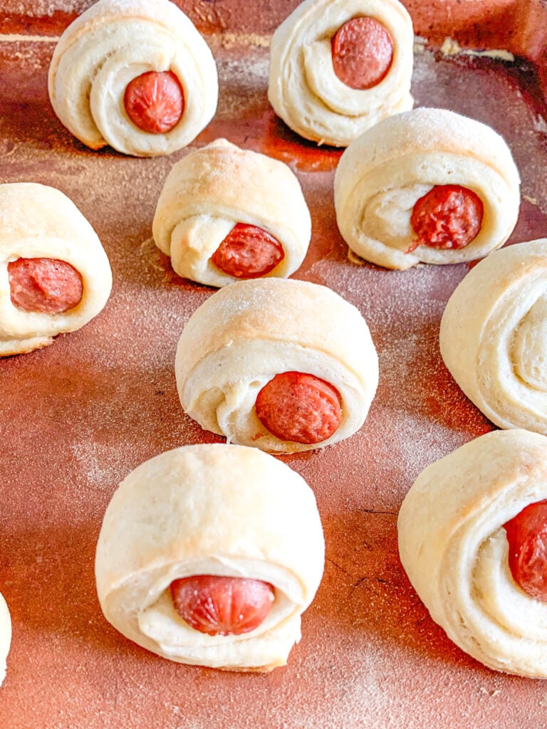 freshly baked mini sourdough pigs in a blanket