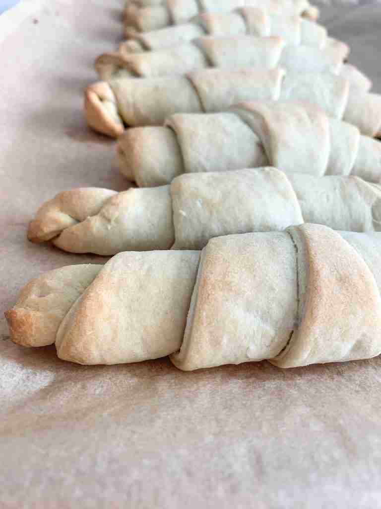 freshly baked flaky sourdough crescent rolls