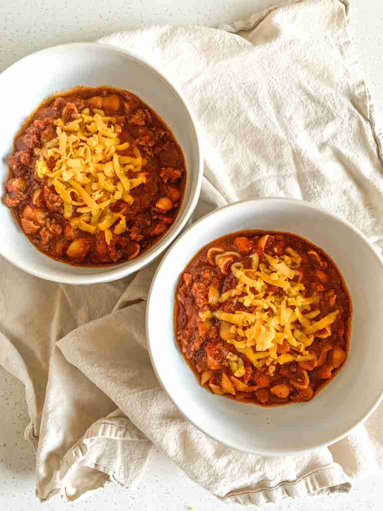 freshly made game day chili topped with shredded cheese