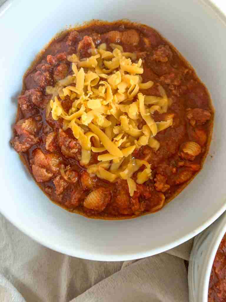 freshly made game day chili topped with shredded cheese