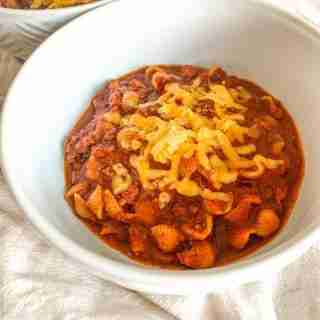 freshly made game day chili topped with shredded cheese