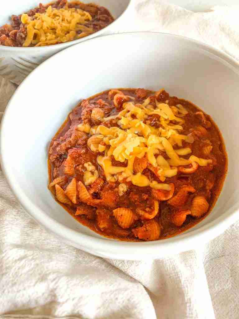 freshly made game day chili topped with shredded cheese