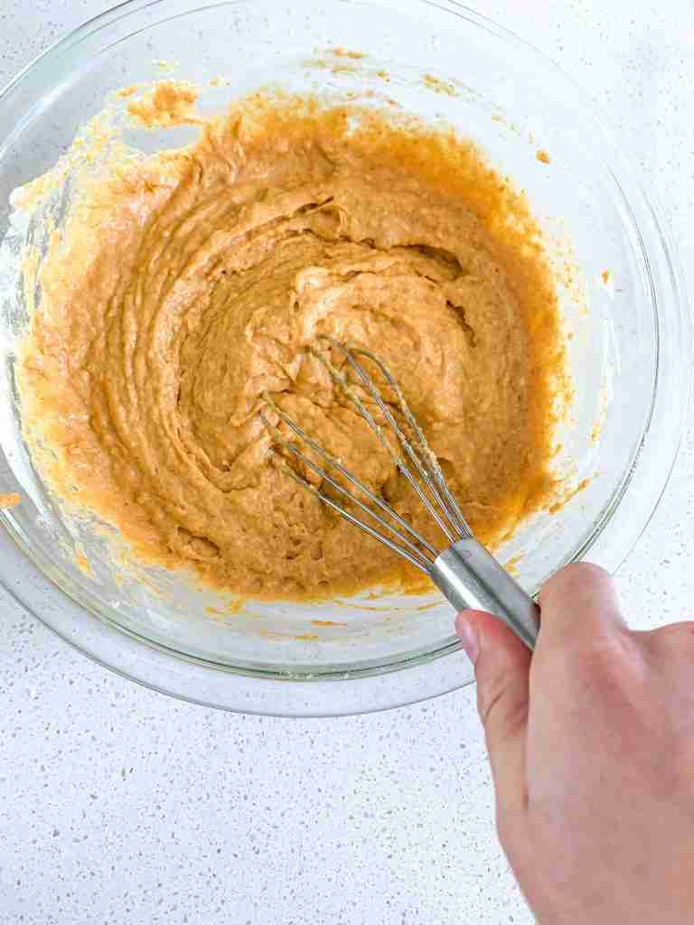 whisking batter for sourdough pumpkin muffins