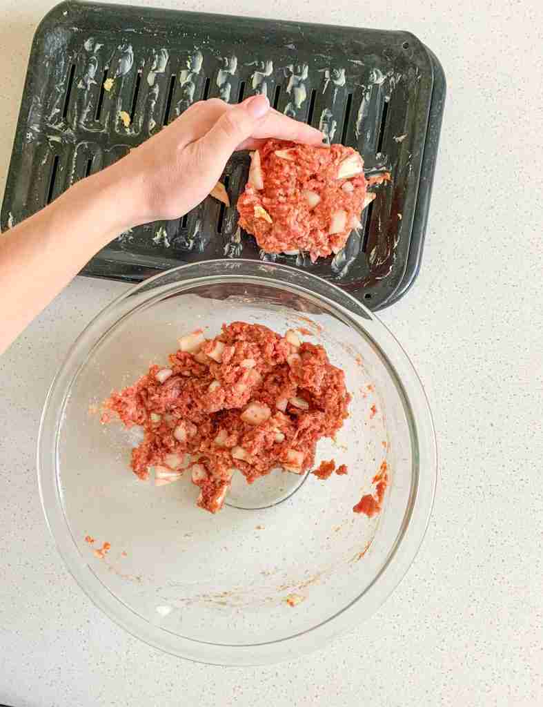 shaping mini meatloaf mixture onto a pan