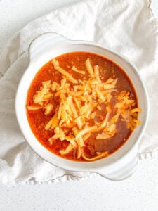 freshly made bowl of game day chili topped with cheese