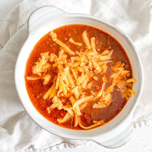 freshly made bowl of game day chili topped with cheese