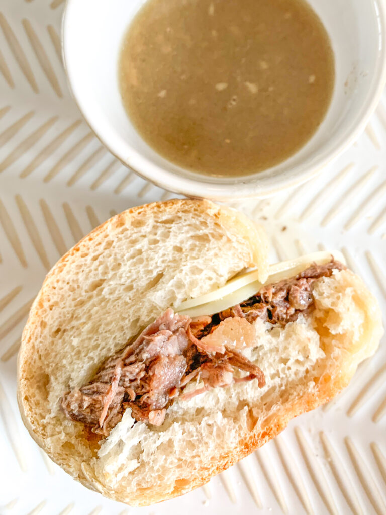 freshly cooked slow cooker french dip sandwich