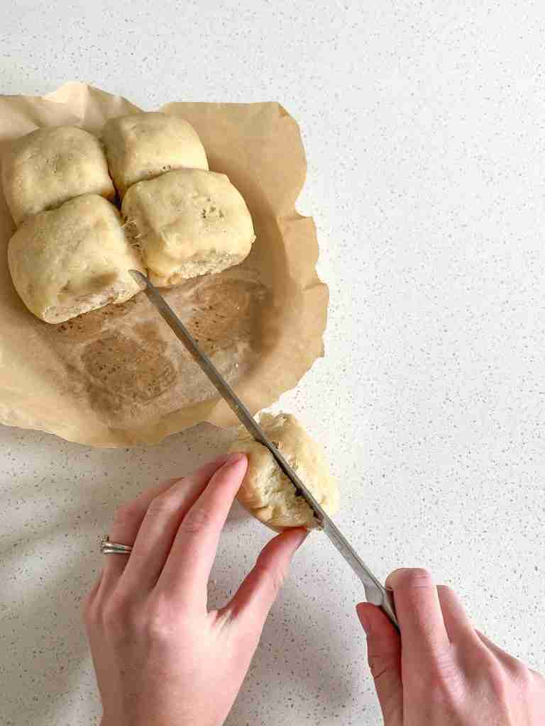 slicing a slider bun to make game day sliders