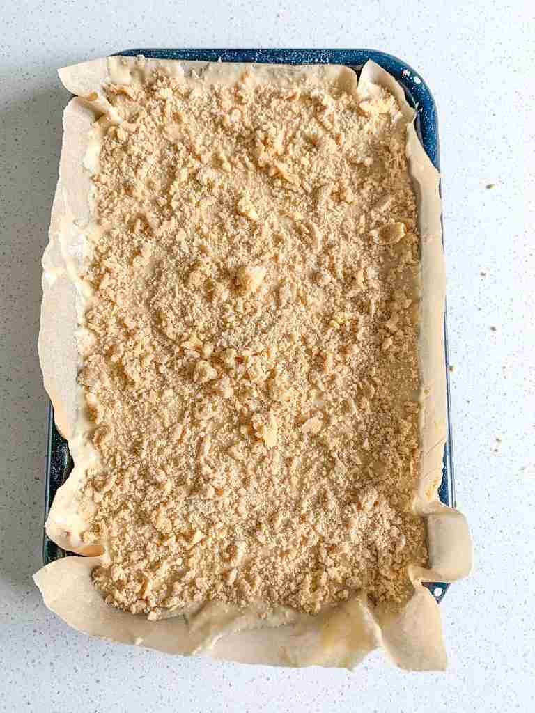 streusel topping added on top of the sourdough coffee cake batter and ready to go in the oven