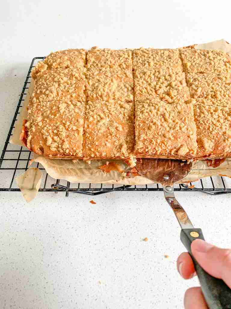 freshly baked sourdough coffee cake being served by a spatula
