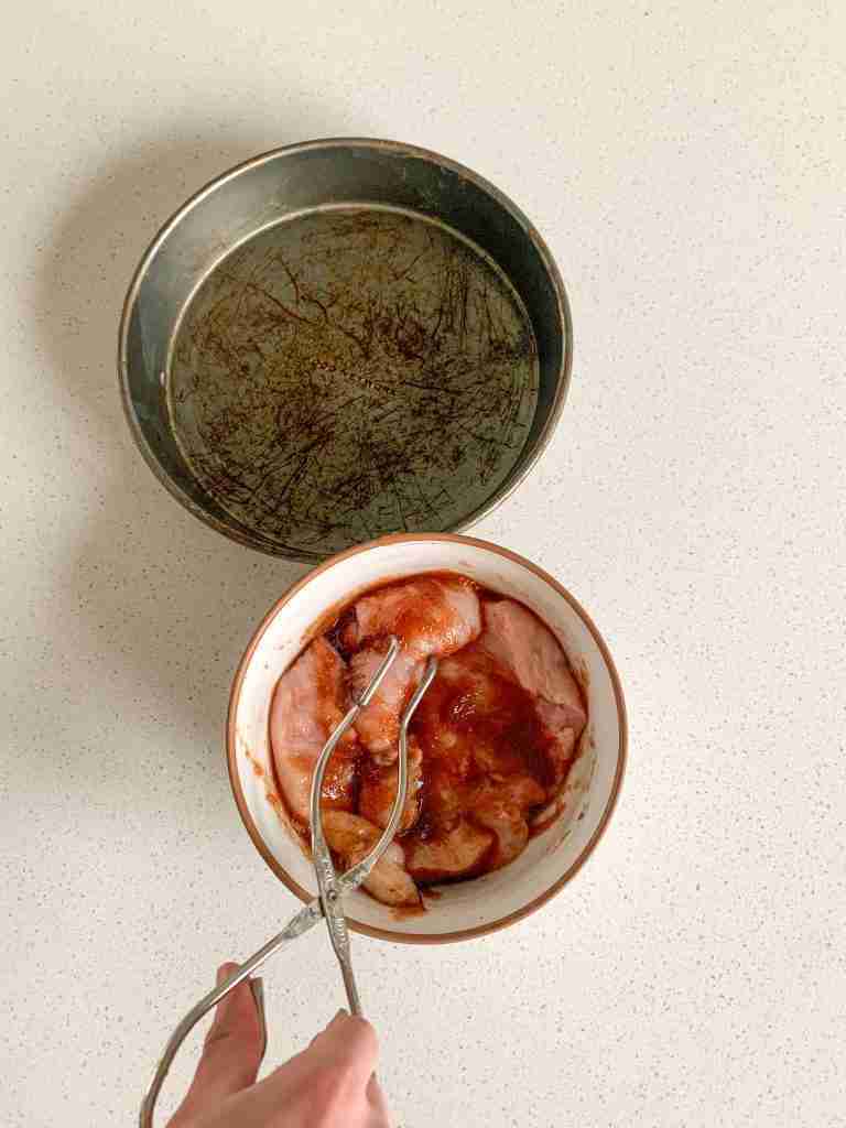 chicken breast getting coated in spiced apple butter