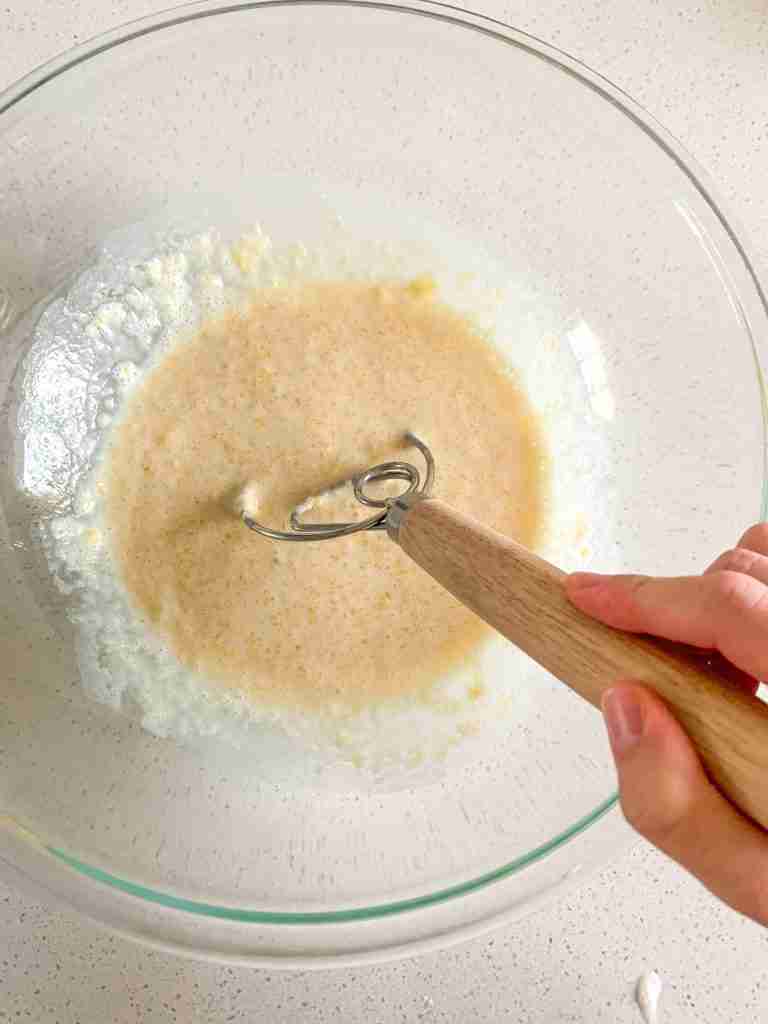 mixing wet ingredients for sourdough parker house rolls