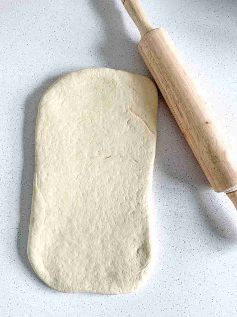 rolled out sourdough parker house roll dough