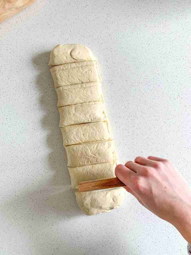 cutting sourdough parker house roll dough into rolls