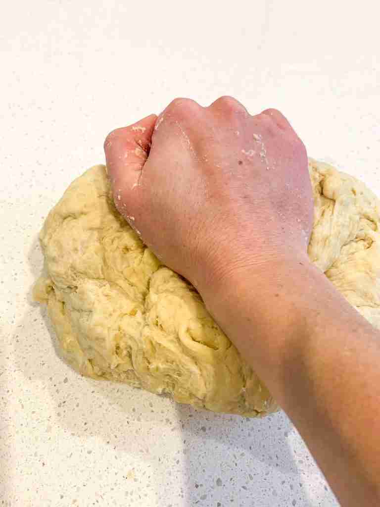 sourdough chocolate babka dough being kneaded