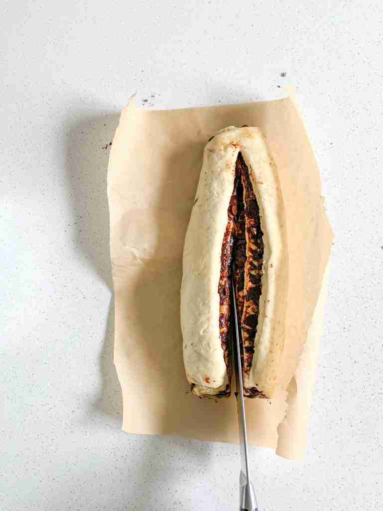 sourdough babka dough being cut for shaping