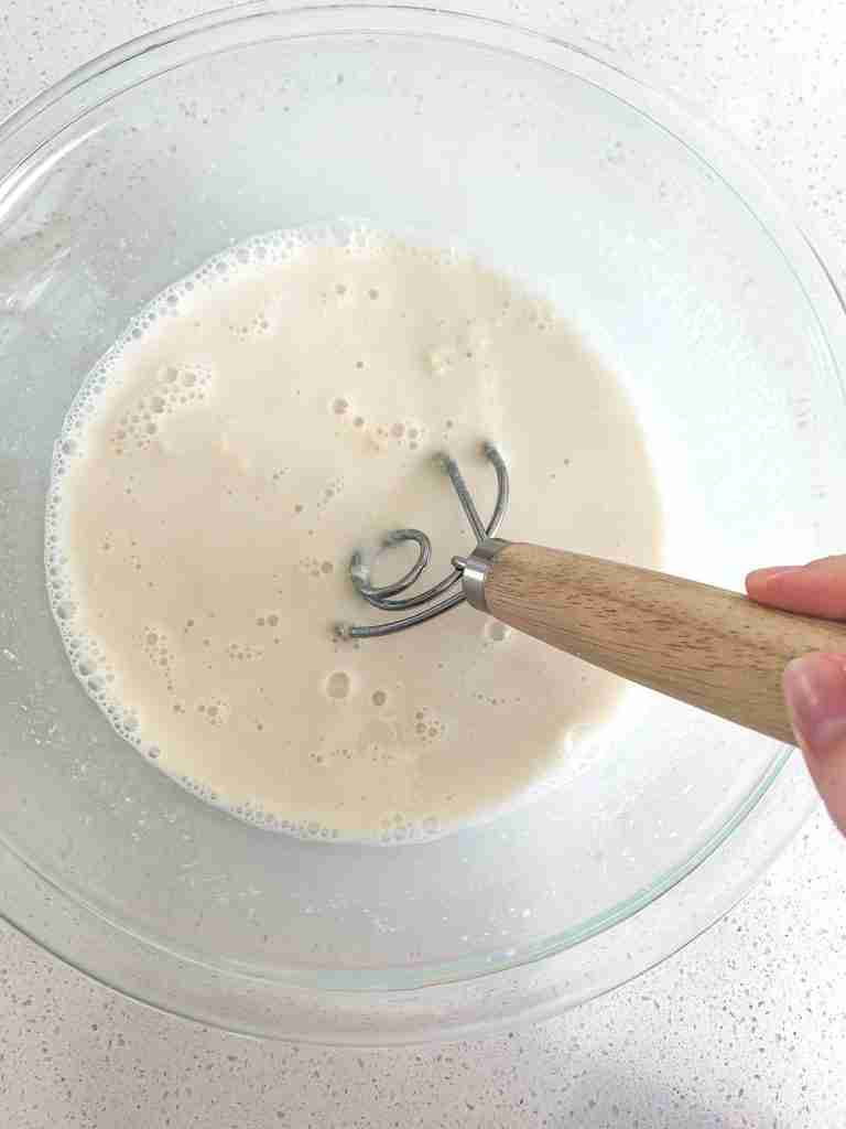 mixing wet ingredients for artisan sourdough loaf