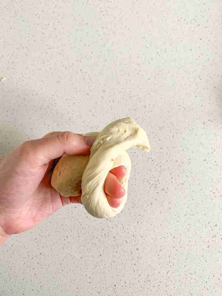 sourdough garlic knot dough getting shaped