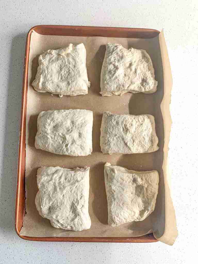 sourdough ciabatta bread dough shaped and on a pan ready to proof