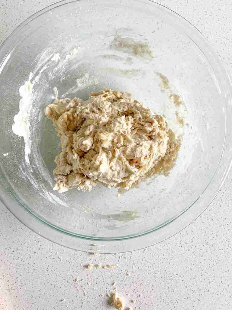 calzone dough in a bowl ready to ferment