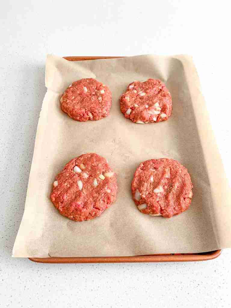 shaped meatloaf patties on a sheet pan