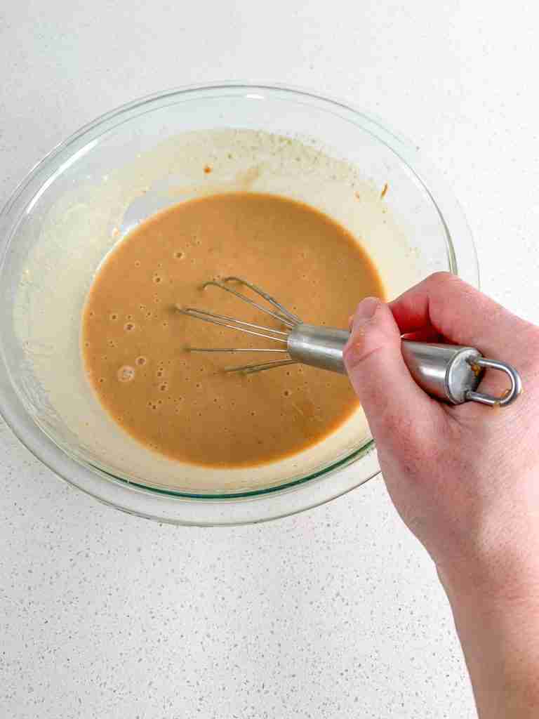whisking sourdough peanut butter chocolate chip muffin wet ingredients