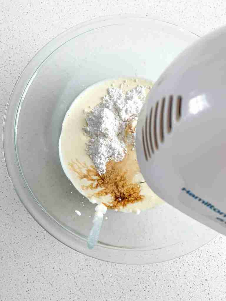 ingredients ready to be whipped for stabilized whipped cream frosting