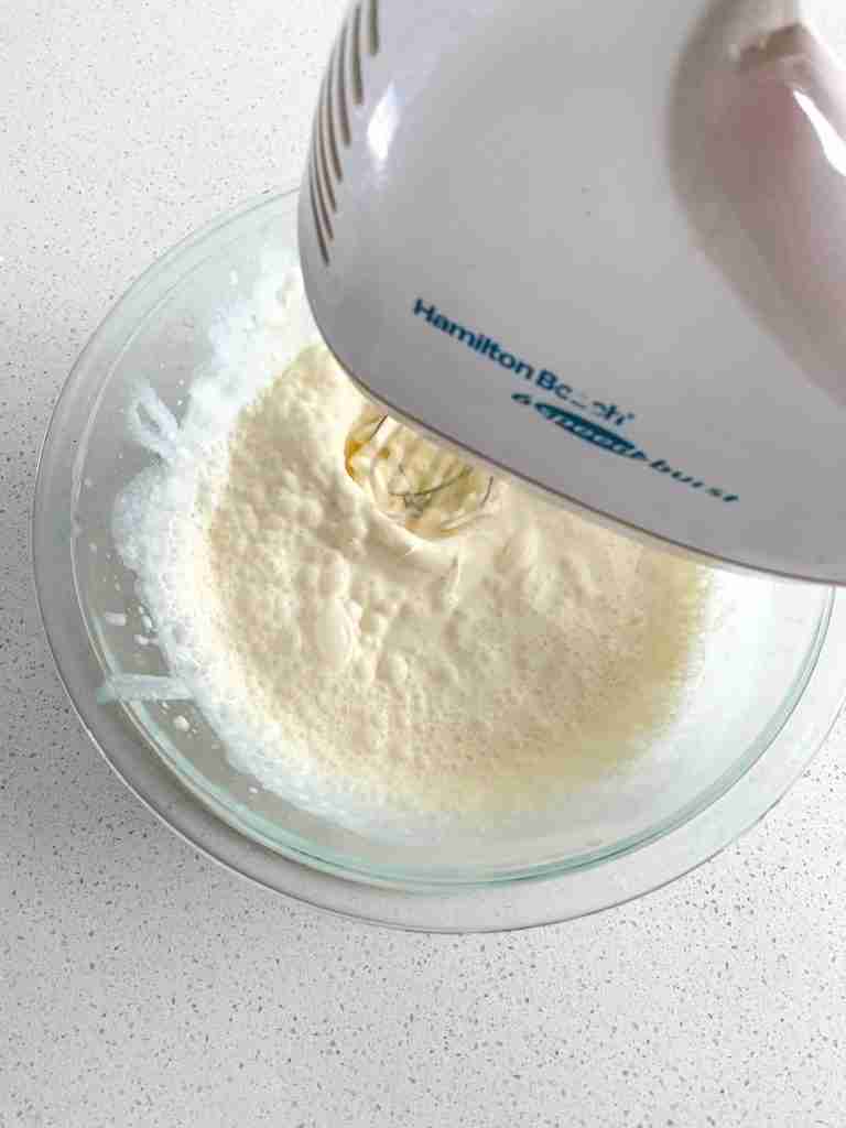 mixing stabilized whipped cream frosting