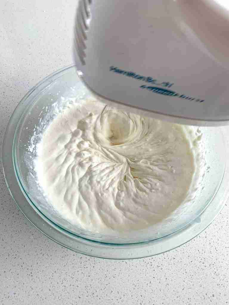 mixing stabilized whipped cream frosting