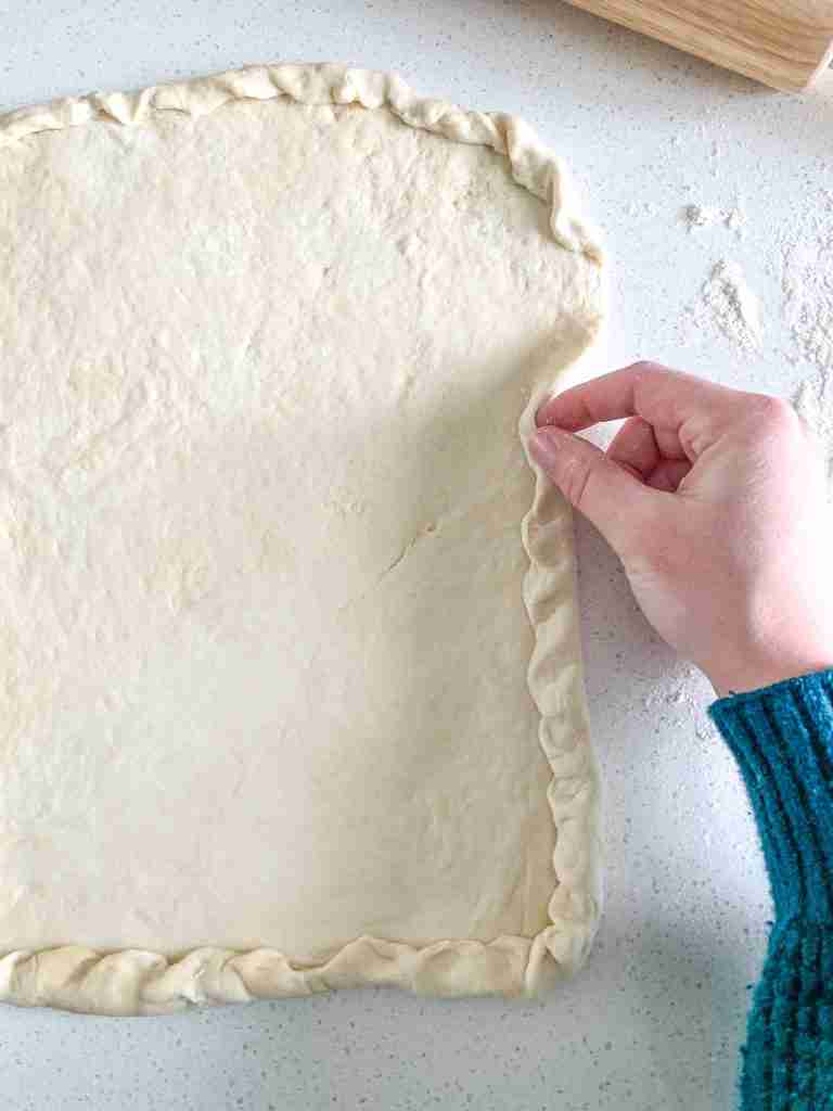 shaping dough for alabama white bbq chicken bacon pizza