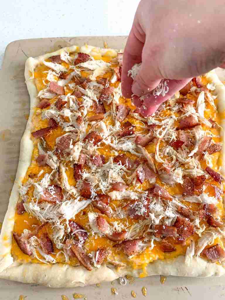 adding parmesan to alabama white bbq chicken bacon pizza