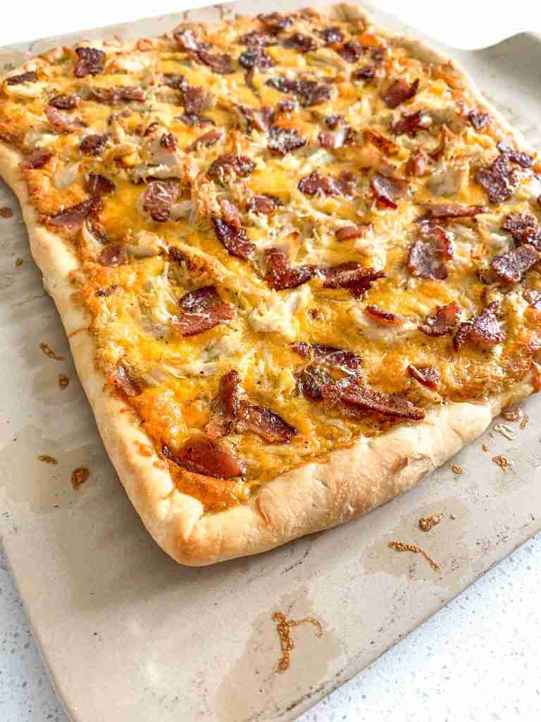freshly baked and cut alabama white bbq chicken bacon pizza