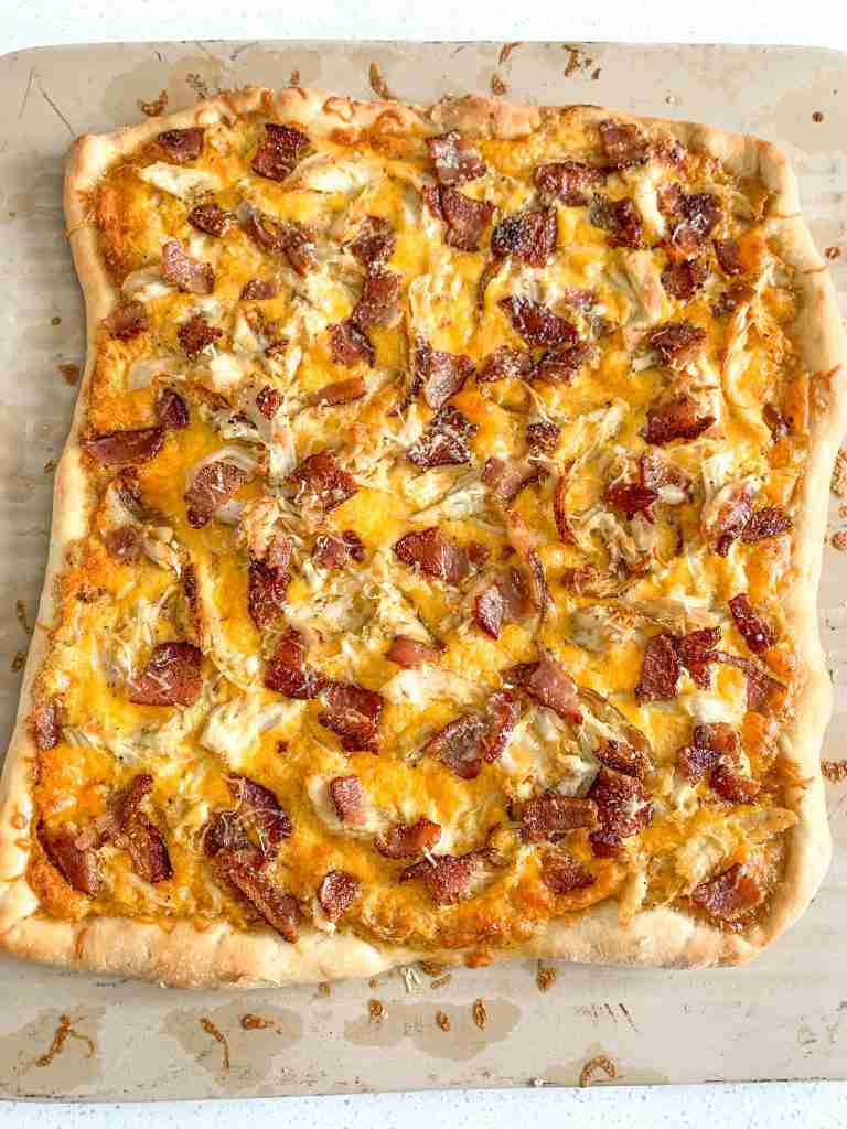 freshly baked and cut alabama white bbq chicken bacon pizza