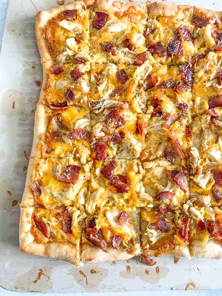 freshly baked and cut alabama white bbq chicken bacon pizza
