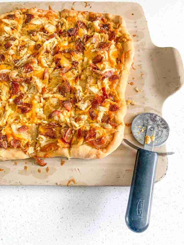freshly baked and cut alabama white bbq chicken bacon pizza