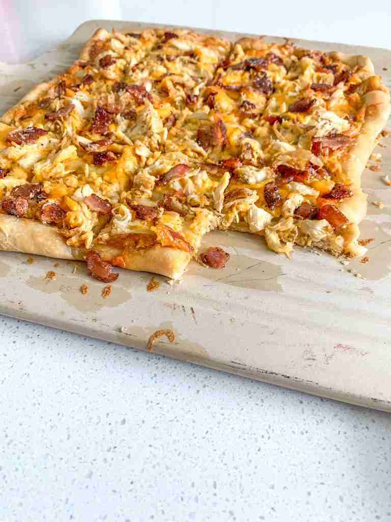freshly baked and cut alabama white bbq chicken bacon pizza