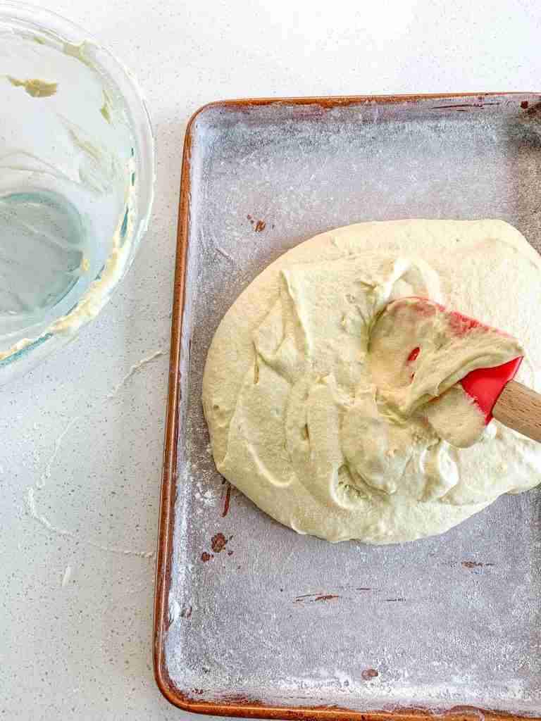 spreading cake batter on a half sheet pan