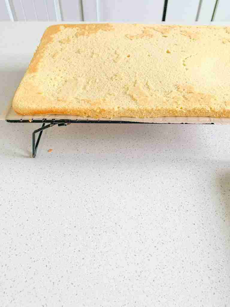 cake cooling on a wire rack