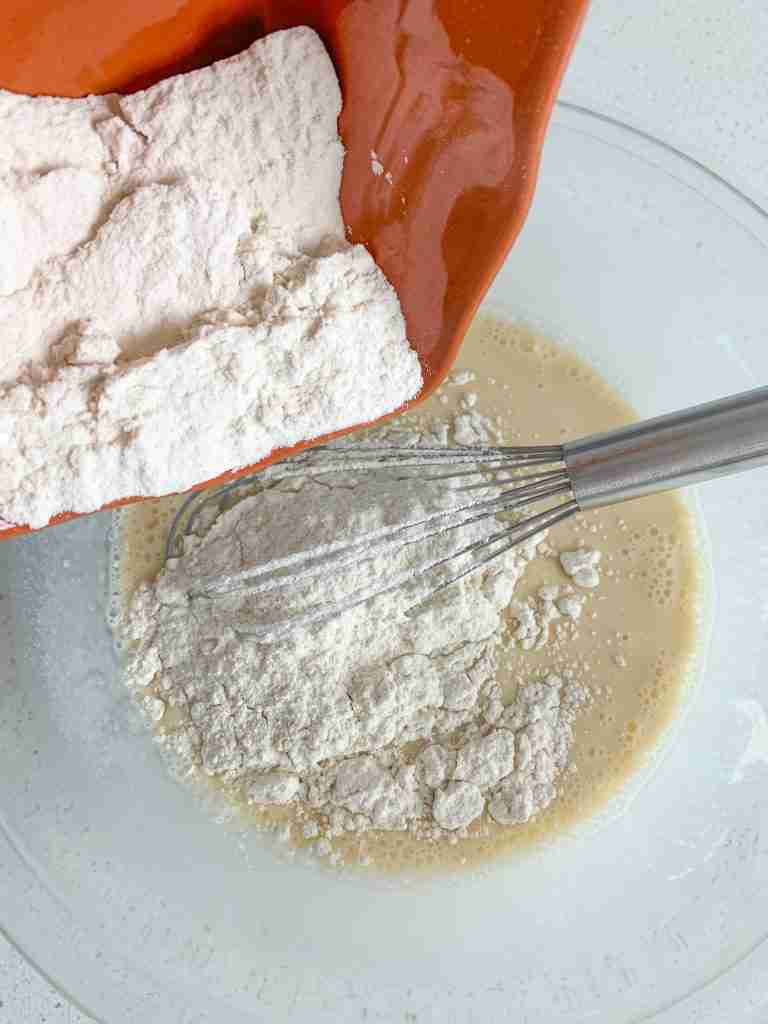 adding flour to wet crepe batter ingredients