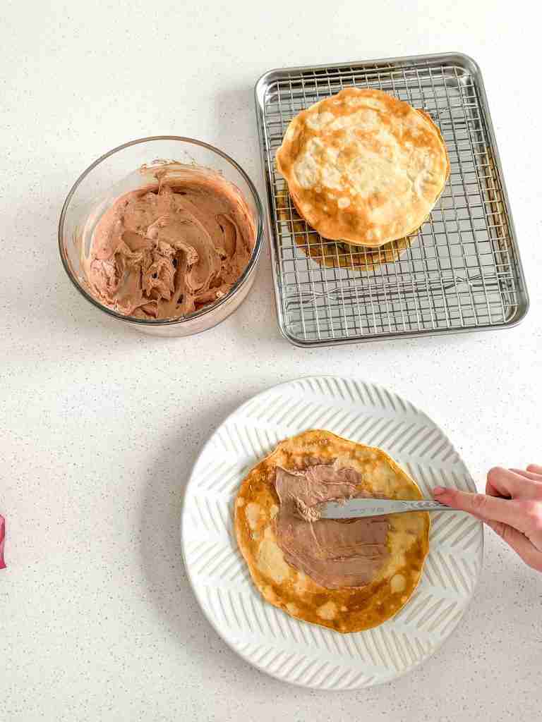 adding filling to cooked sourdough crepes