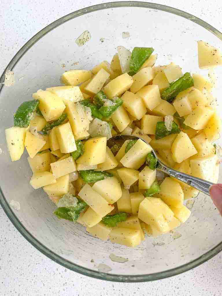 potato mixture for bacon breakfast burrito getting mixed up