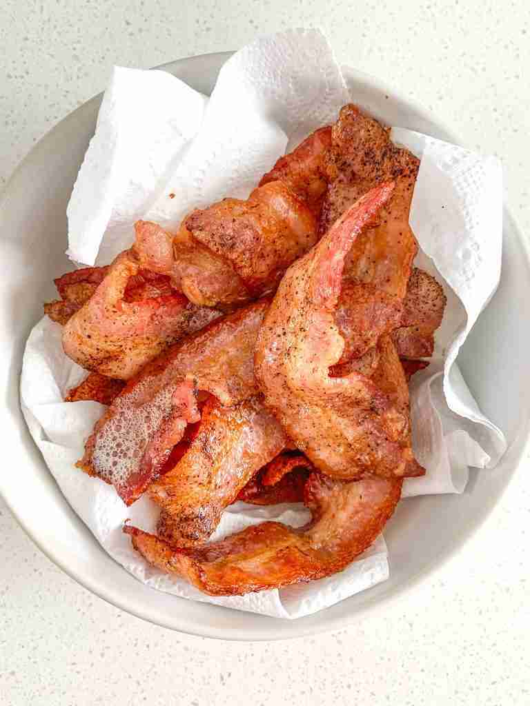 bacon cooked and draining on paper towel for bacon breakfast burrito