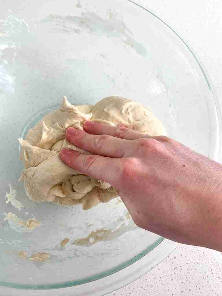 kneading maple cinnamon roll dough