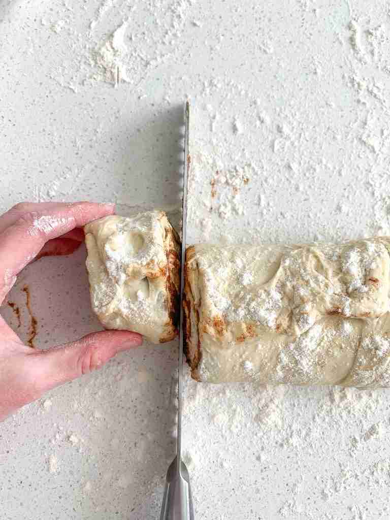 cutting sourdough maple cinnamon rolls dough