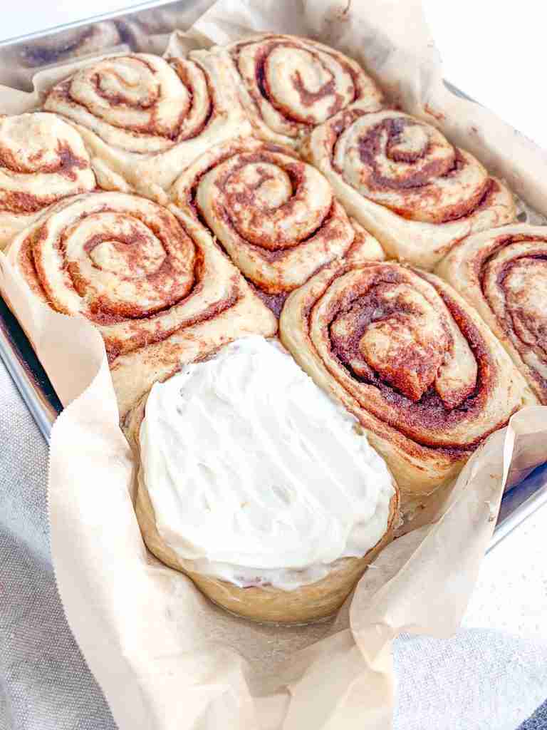 frosted freshly sourdough baked maple cinnamon rolls