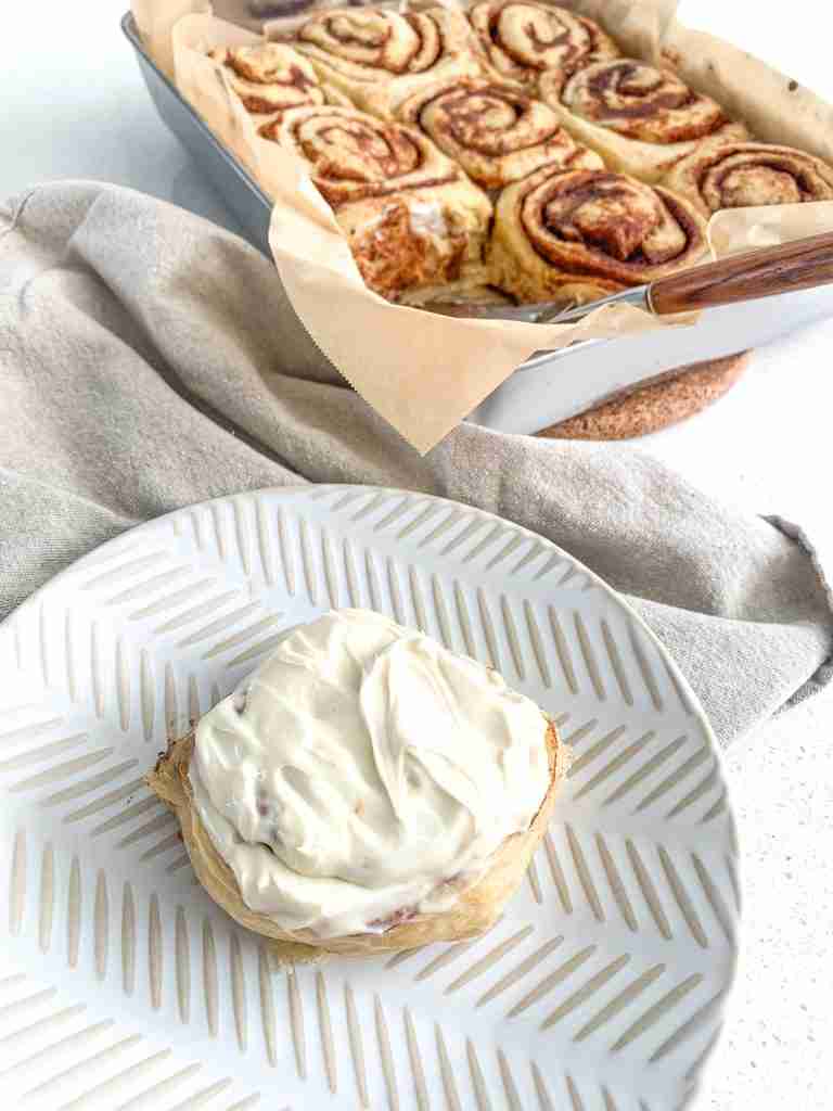 frosted freshly sourdough baked maple cinnamon rolls